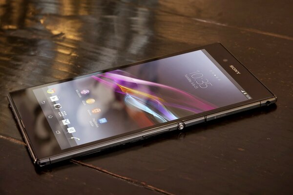 SONY S SMARTPHONE ON THE VARNISHED FLOOR