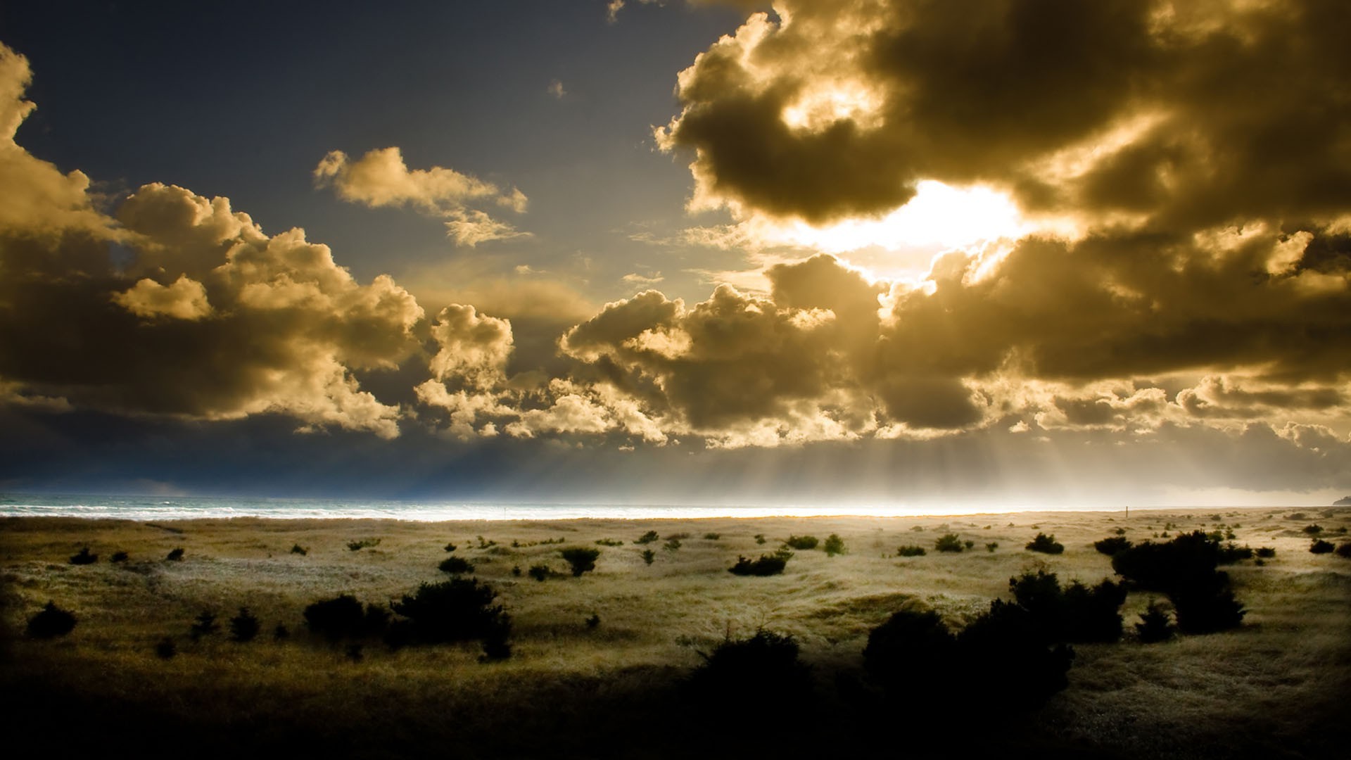 the sunlight and rays sunset water beach sky sun storm landscape dawn nature sea ocean dramatic dusk fair weather evening seascape cloud weather