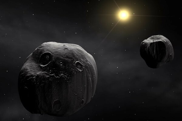 Sfondo scuro, asteroidi e spazio