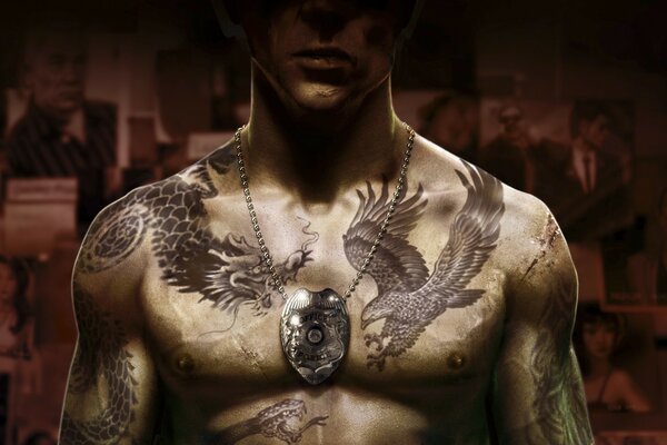 A man in tattoos . a fragment of a computer game