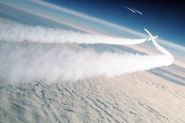 White stripes from an airplane in the sky