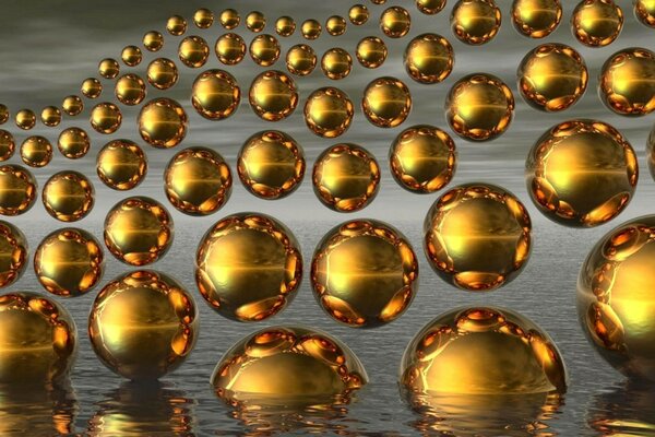 Una gran cantidad de bolas de oro parcialmente sumergidas en el agua