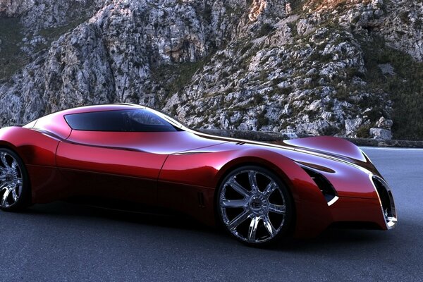 Voiture de sport rouge sur la piste de montagne