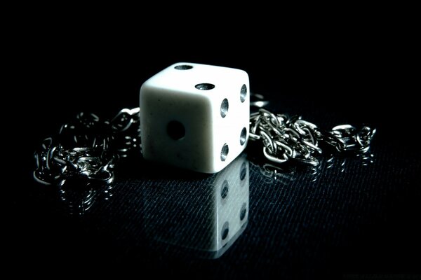 A dice on a dark background