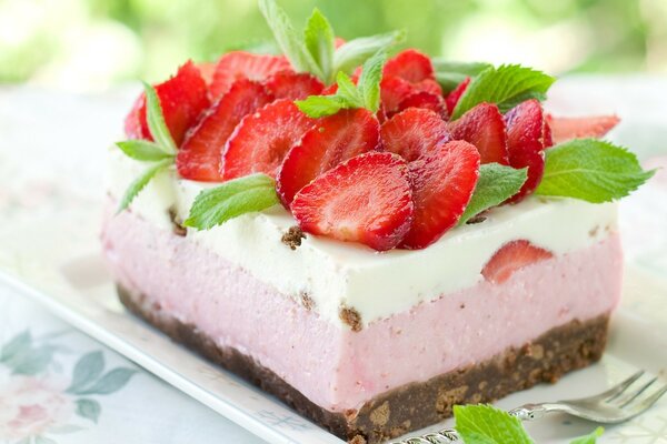 Delicious cake with strawberries and souffle