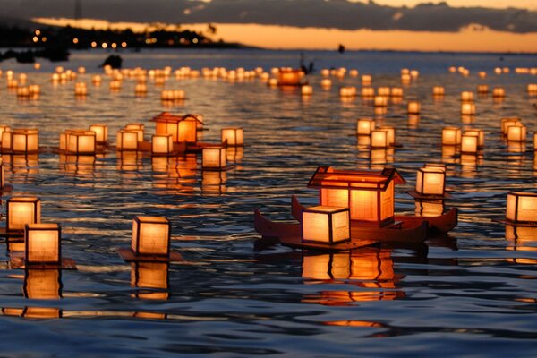 Holiday lanterns float on the water