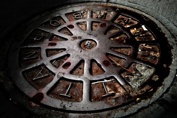 An old manhole with the Rockstar Games logo