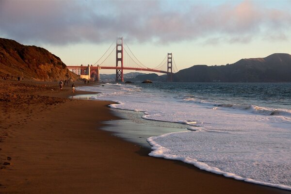 Sandy beach and frothy waves