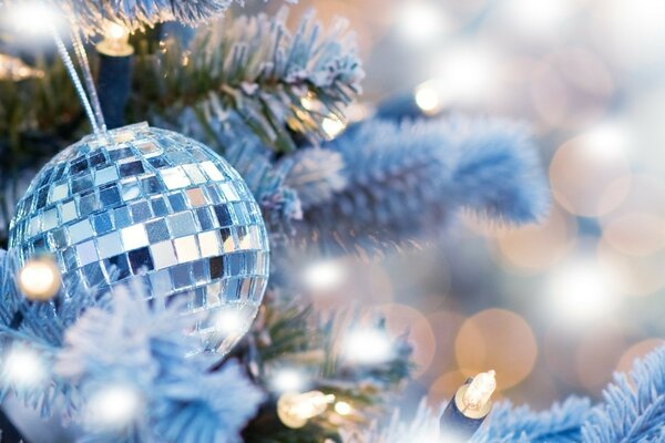 Mirrored Christmas balls on a white spruce