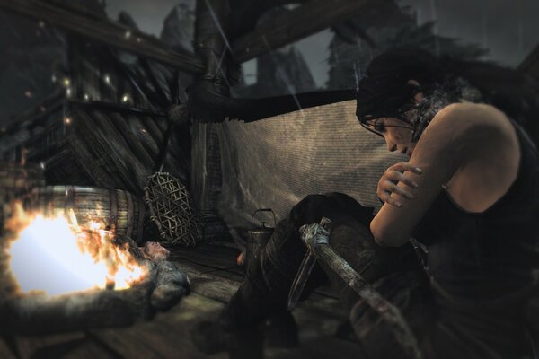 Lara Croft in a campfire in a cave