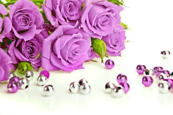 A gorgeous bouquet of lilac roses, surrounded by beads