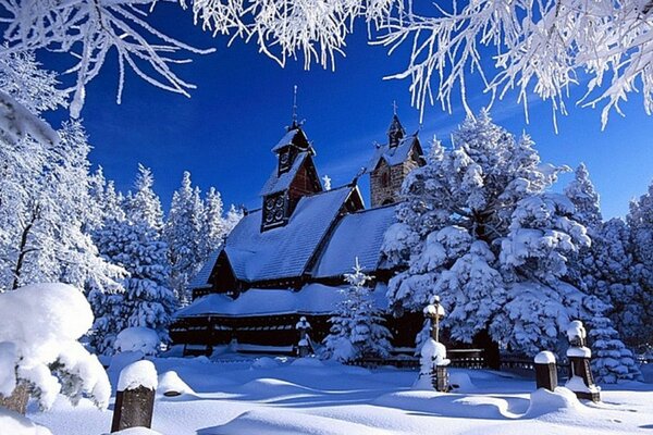 Church in winter covered with snow