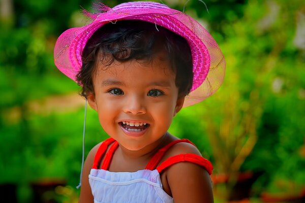 Cute girl in a pink hat