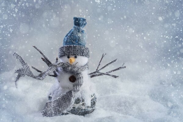 A smiling snowman in a hat and scarf