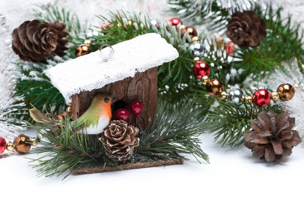 Christmas tree decoration with a bird and cones