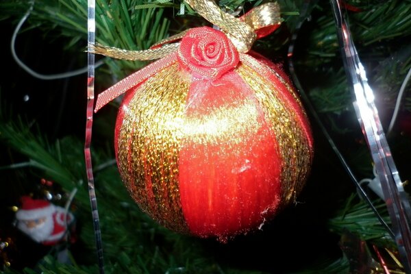 Red Christmas tree decoration on a pine tree