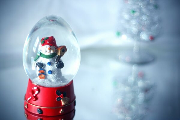 Bola de cristal de Navidad con muñeco de nieve