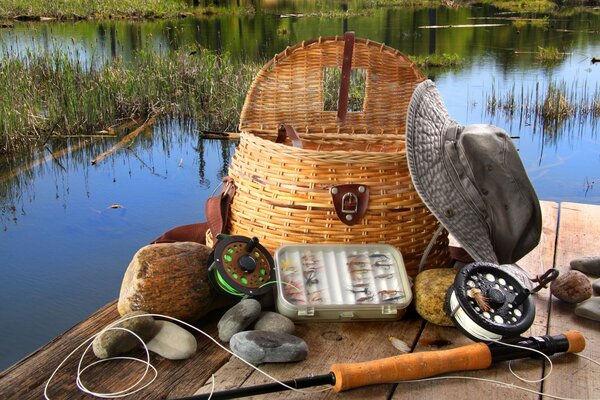 Different fishing gear on the background of the lake