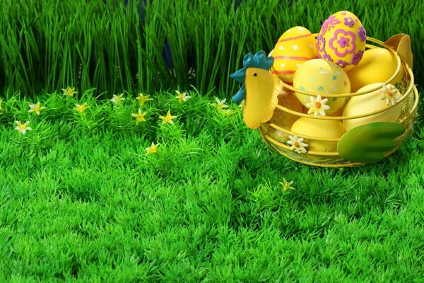 Basket with Easter eggs on a fresh lawn