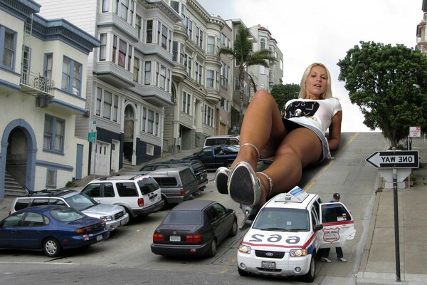 A huge girl is lying on the highway