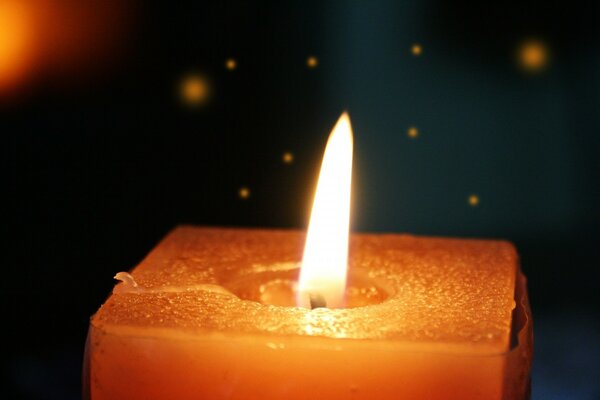 A square candle in a dark room