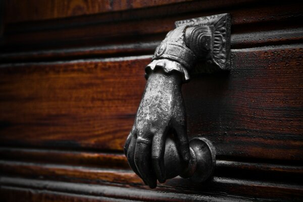 Moldings on the wall in the form of a hand