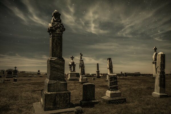 Cemetery at sunset in monochrome colors