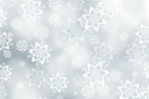 A pink background with snowflakes imitating a window frozen in the cold