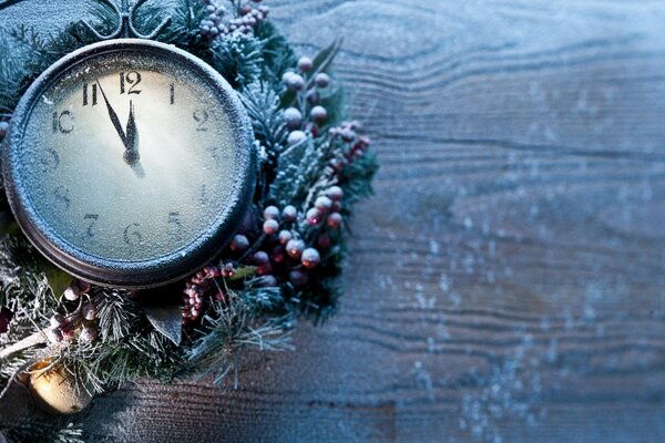 Winter clock with a spruce branch