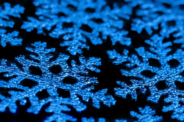 Blue snowflakes on a black background