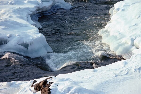 The stream broke a road through the ice