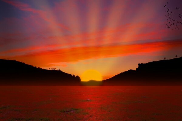 Puesta de sol roja en el mar. Paisaje marino