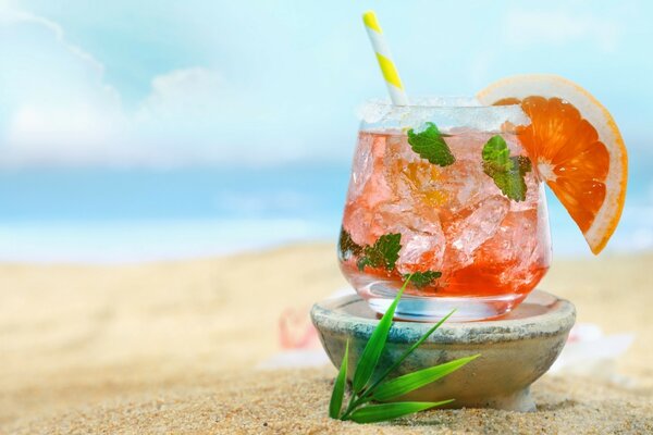 Tropical drink on the beach by the sea