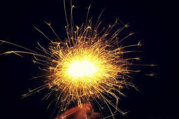 A yellow sparkler in your hand