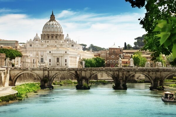 A beautiful bridge that crossed the river on the background of the city