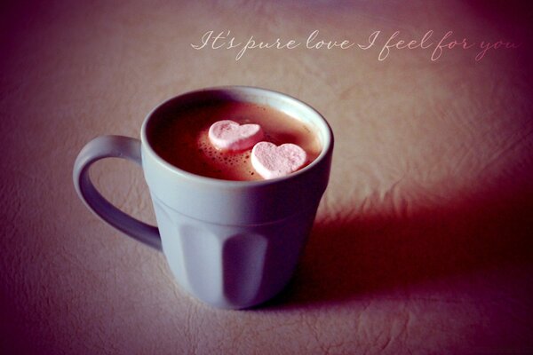 A cup of coffee with marshmallows. Love