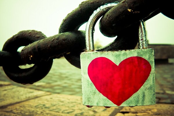 Lock with a red heart on a chain