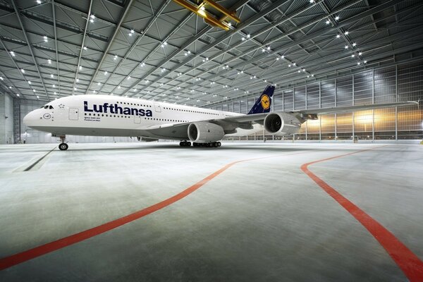 A large plane standing in a hangar