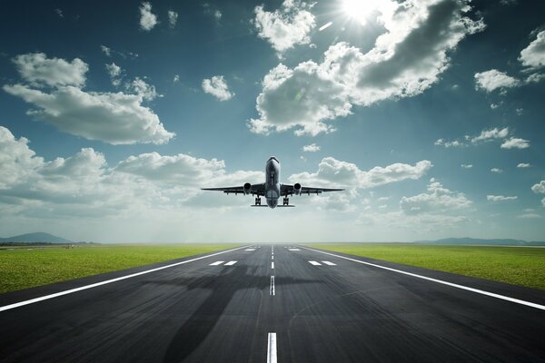 The plane takes off against the blue sky