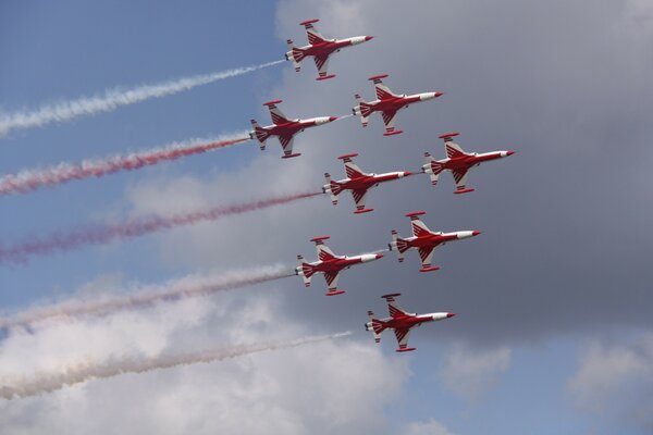 Eight planes are flying in formation