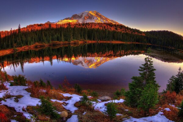 Sunset on the shore of a beautiful lake