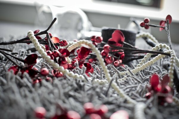 Beads on the windowsill in red and white in a macro frame