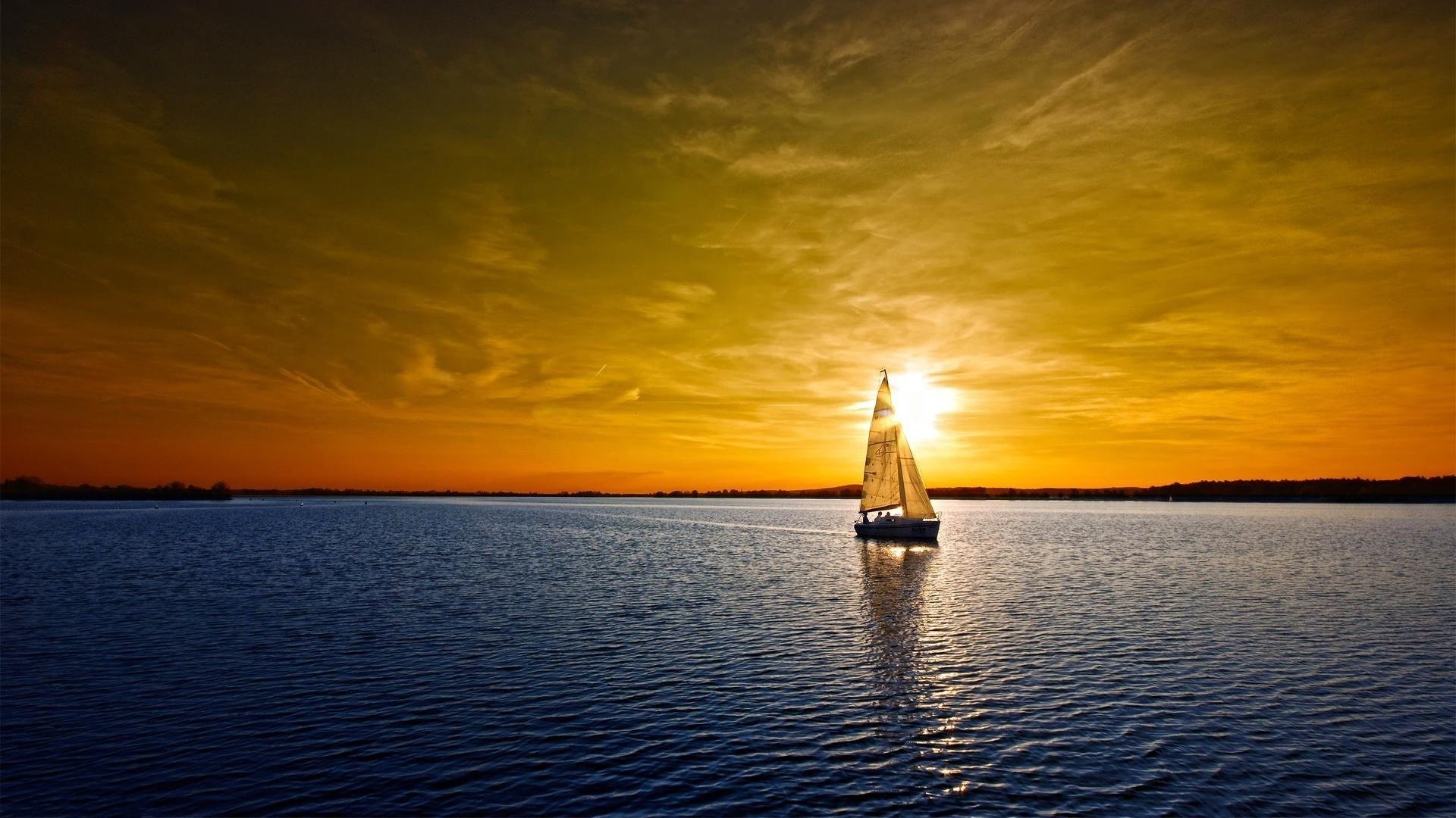 the sunset and sunrise sunset water dawn dusk sun evening reflection sky sea travel ocean lake