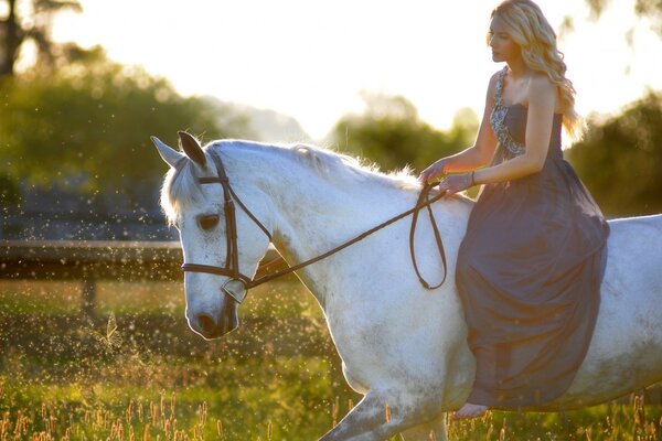 A woman rides a horse