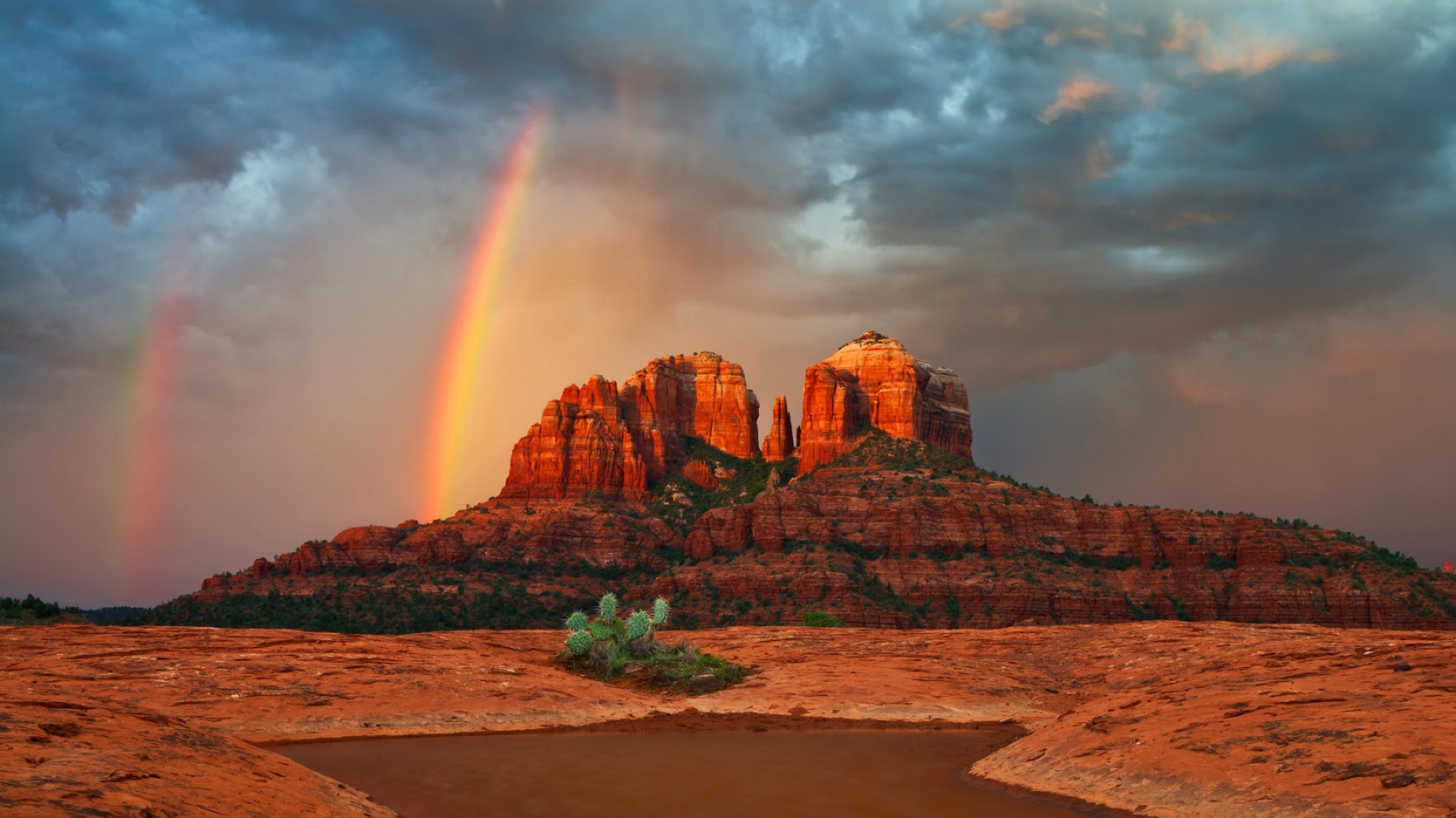 rainbow sunset travel landscape outdoors sky dawn rock desert evening water mountain scenic