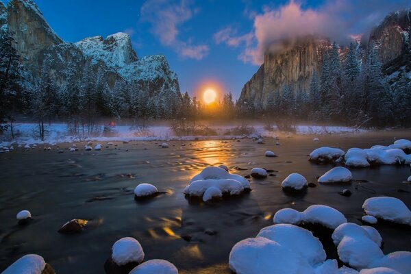 Sunrise on the lake in the mountains