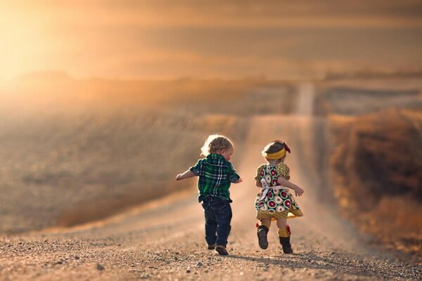 A boy in a plaid shirt and a girl in a climbing dress