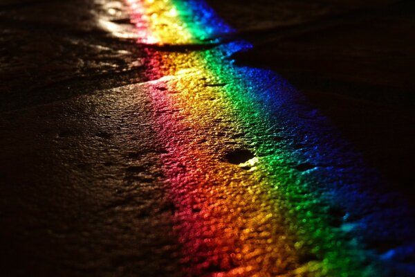 Rainbow colors on asphalt background