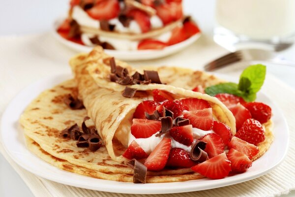 Pancakes with strawberries and chocolate