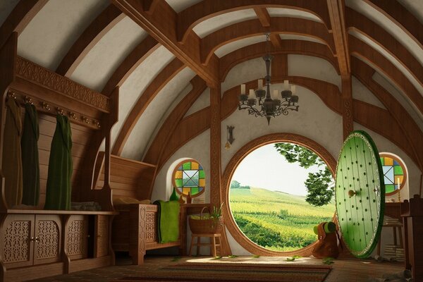 Round window in the house with a view of the field